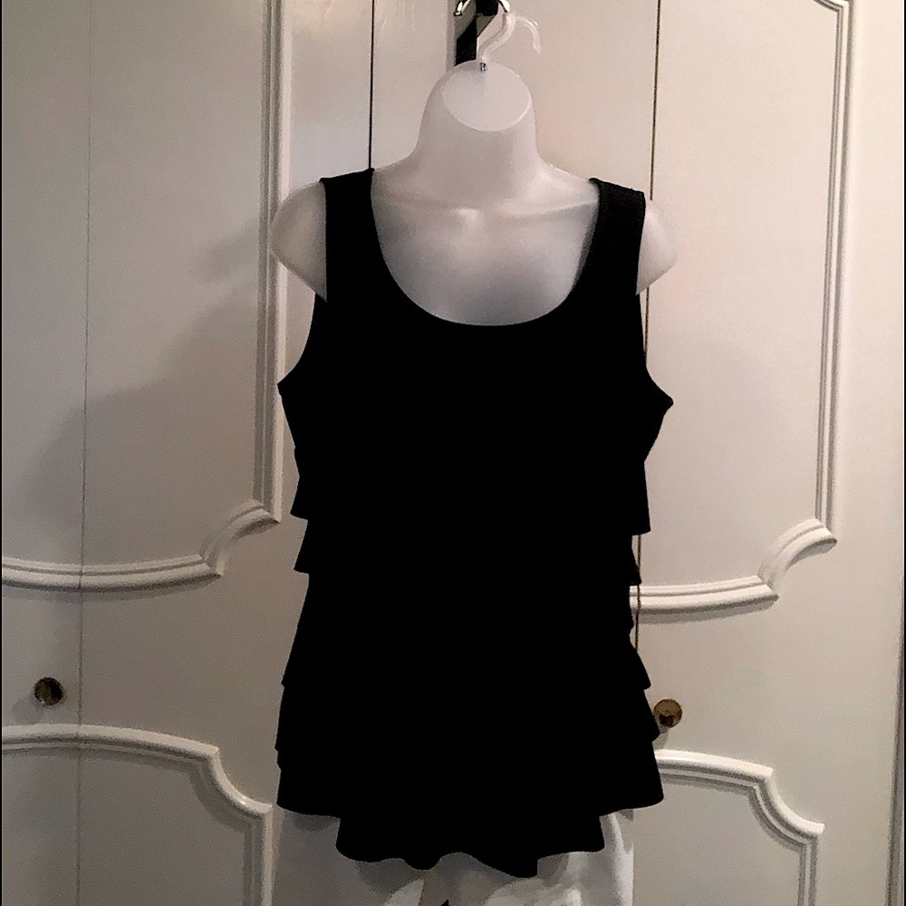 Ruffled front, flat back jersey top. Imported fabric.